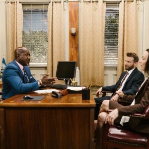 Lawyers discussing with a client in a professional office environment. Business meeting concept.